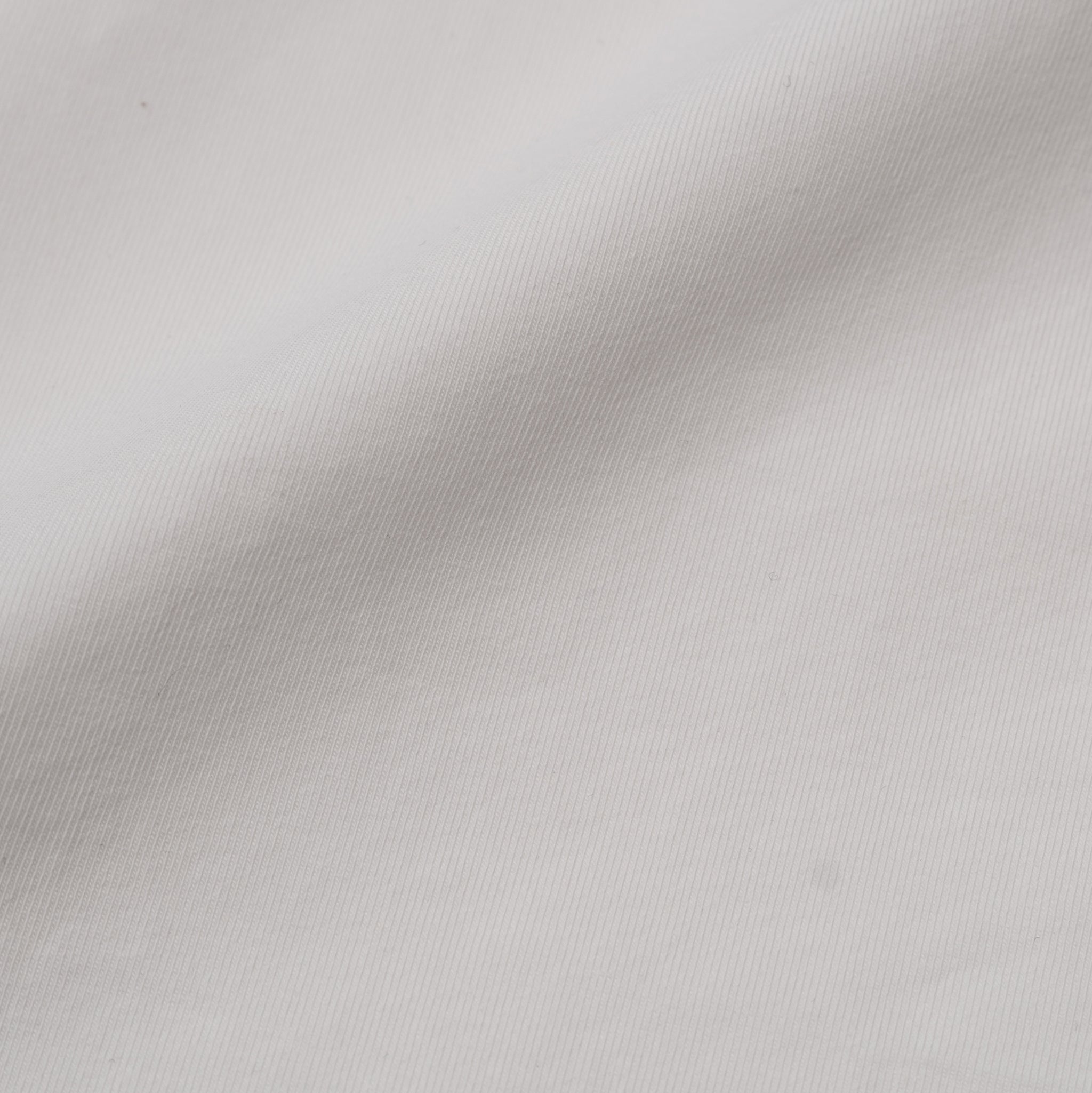 Close-up of white Pima cotton fabric texture.